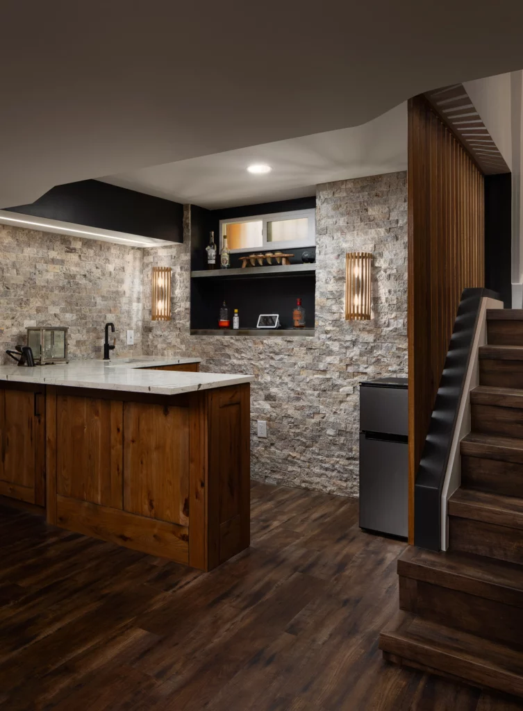 Lower level bar kitchen with open shelving and sink area