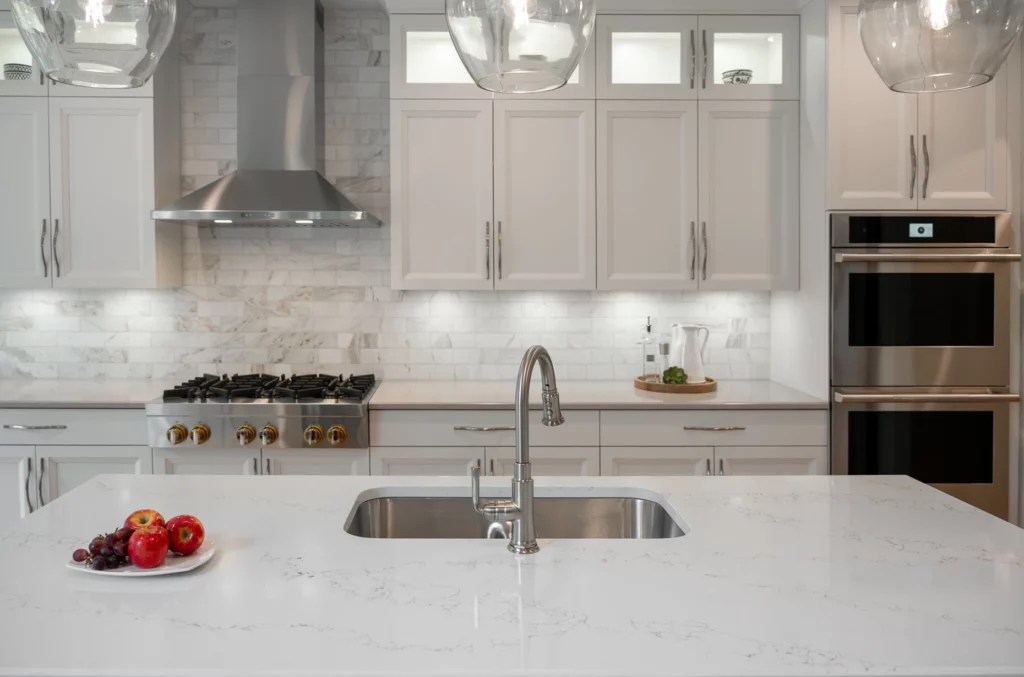Contemporary kitchen with island and integrated appliances